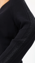 Sweater with decorative accents