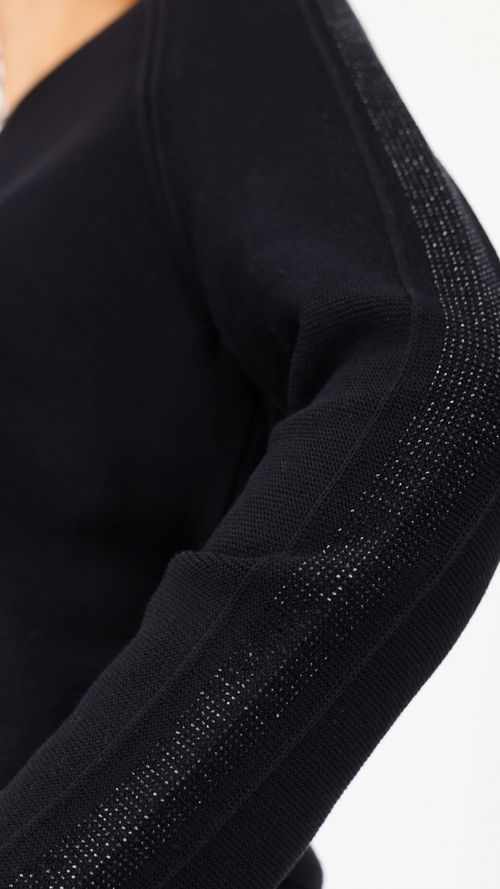 Sweater with decorative accents
