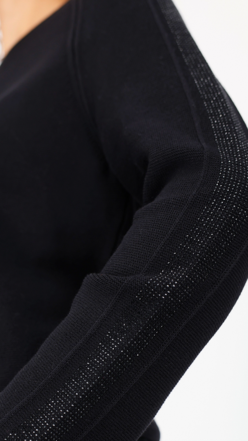 Sweater with decorative accents