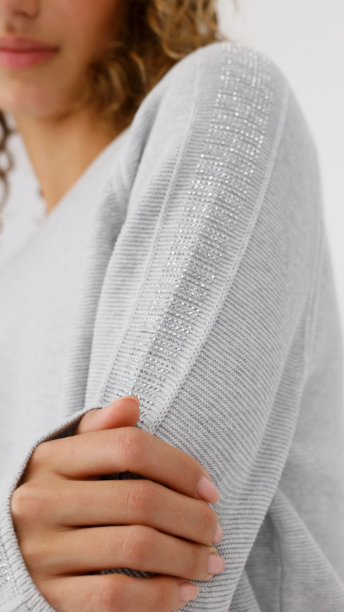Sweater with decorative accents