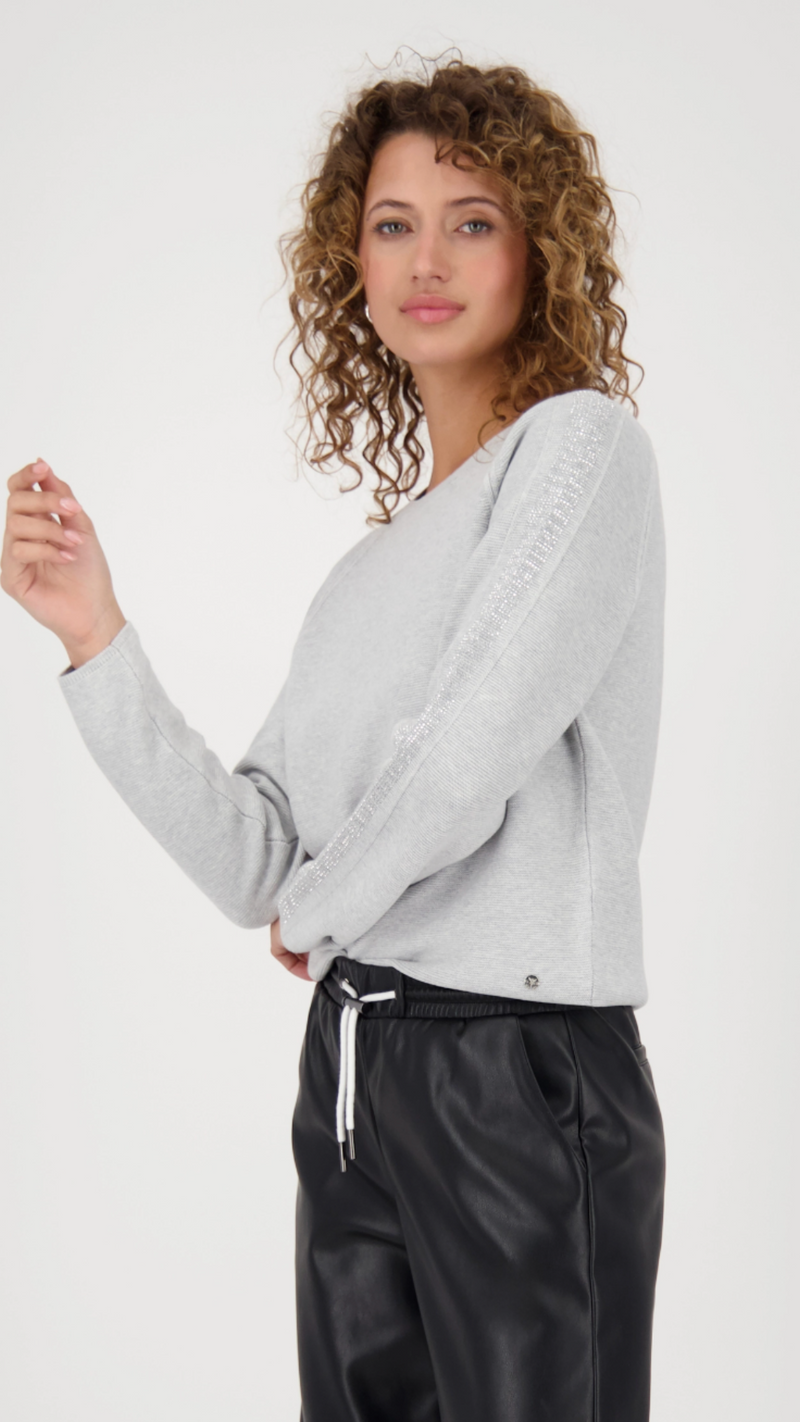 Sweater with decorative accents