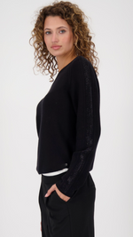 Sweater with decorative accents